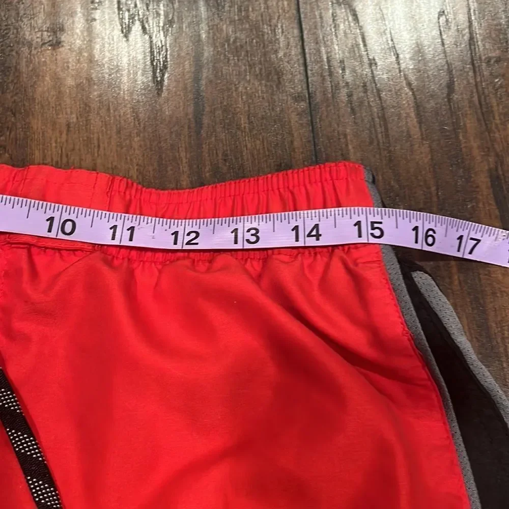 nike swim trunks size L red and black embroidered grey logo EUC with pockets